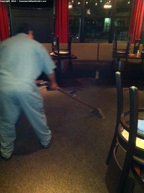 Floor cleaning crew in uniform cleaning carpets