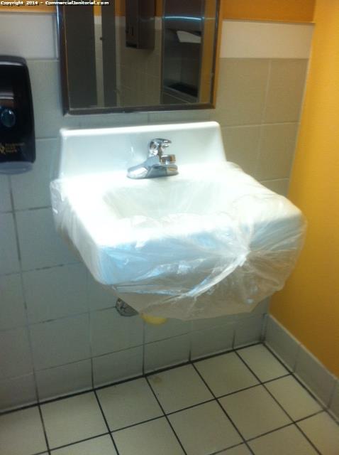 The night crew was in the process of cleaning the sinks when they realized this one did not work so they sealed it with a trash bag in the meantime 