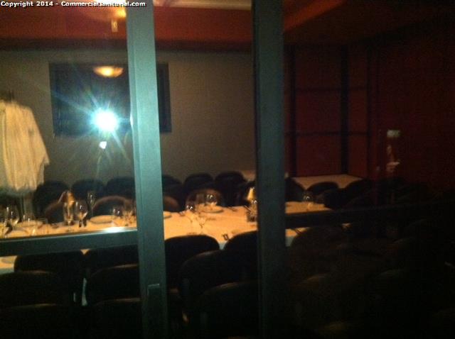 In a restaurant. Looking into the private dining room