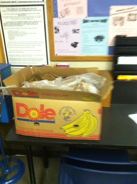  box of bananas on top on table in lobby upon arrival  
