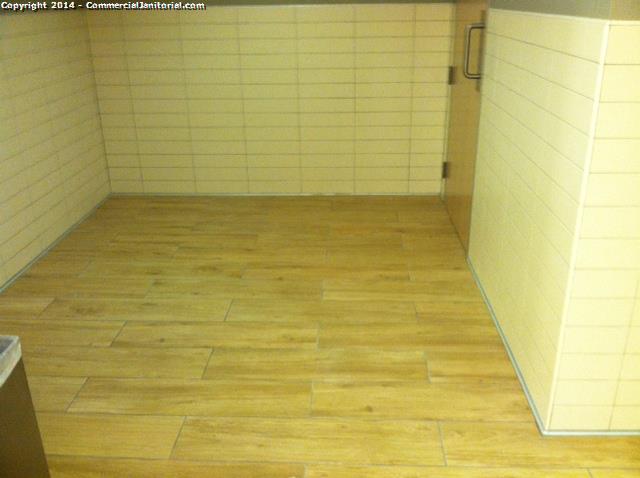 Entrance into the restroom has been Swept & mopped 