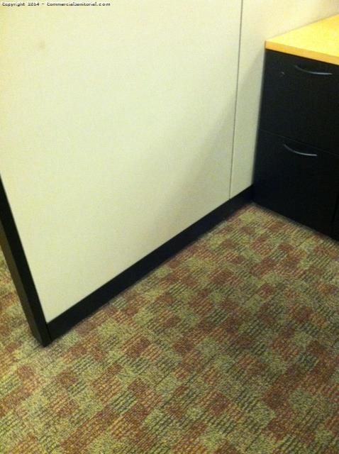 Cubicles base boards has spills all over the cubicles which has been resolved , carpets have been vacuumed . 