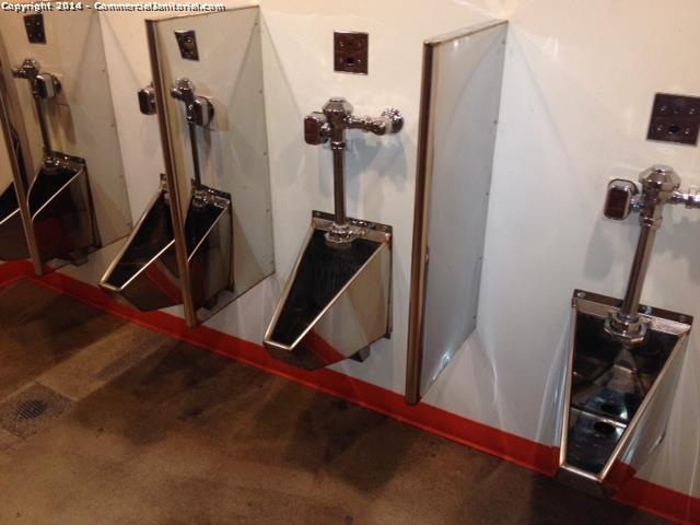 Restroom urinals are looking clean and shined.
