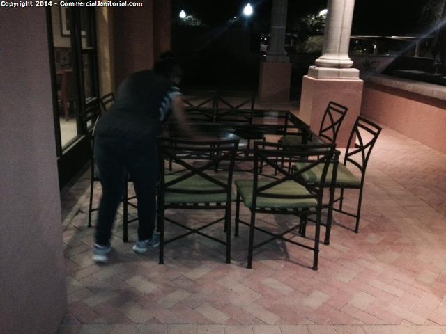  Patio area was cleaned , Tables were wiped down , Chairs cleaned, Floor was swept . 