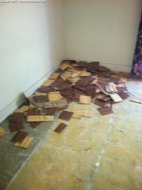 Removing large debris as part of a construction cleaning in a home