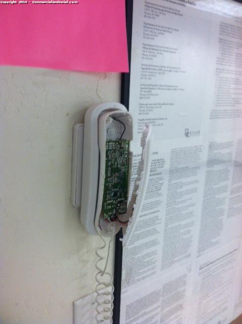 Phone mounted on wall seems to be broken , told customer about the situation and said they would resolve it . 