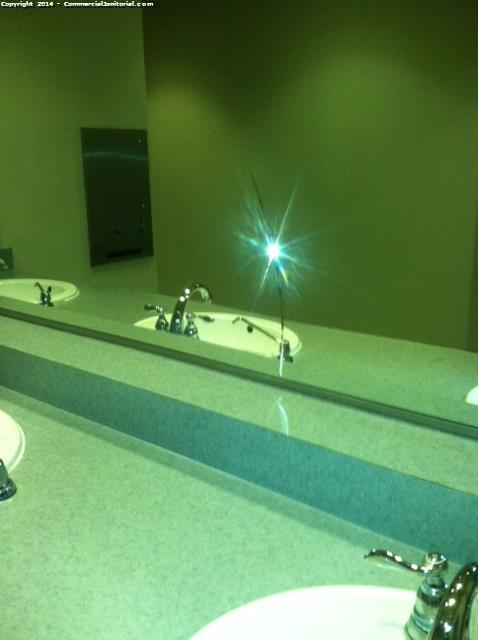 When my crew was going to clean the restrooms they noticed the mirror has a crack which client has been notified . 