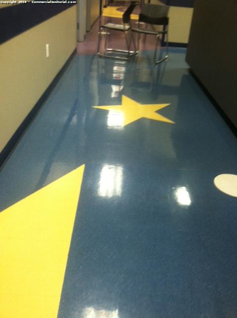 Cleaning the hallway floors in a medical clinic