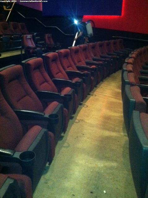 inside of the theater each seat was cleaned underneath , each arm rest and cup holder were disinfected , floors have been Vacuumed .