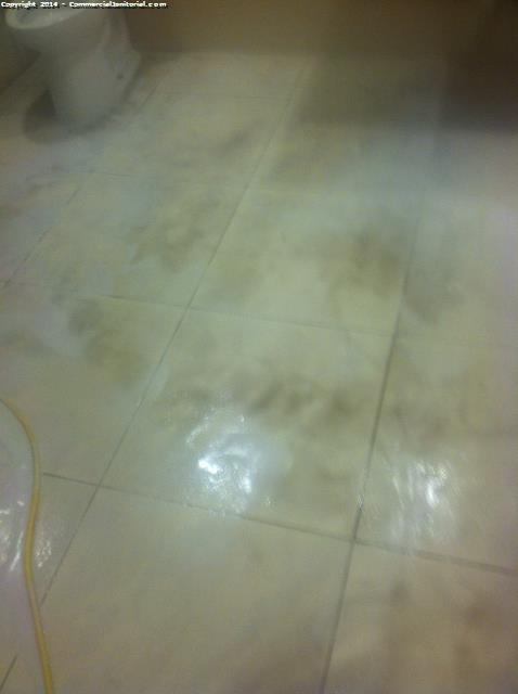 Images of dirty water during the tile cleaning process