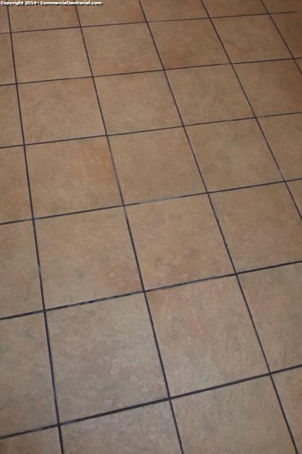Close up of clean ceramic floor after mopping a bank